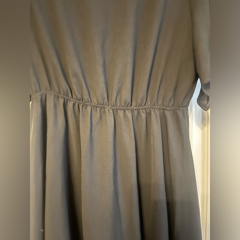 Black, knee length dress. Formal or casual